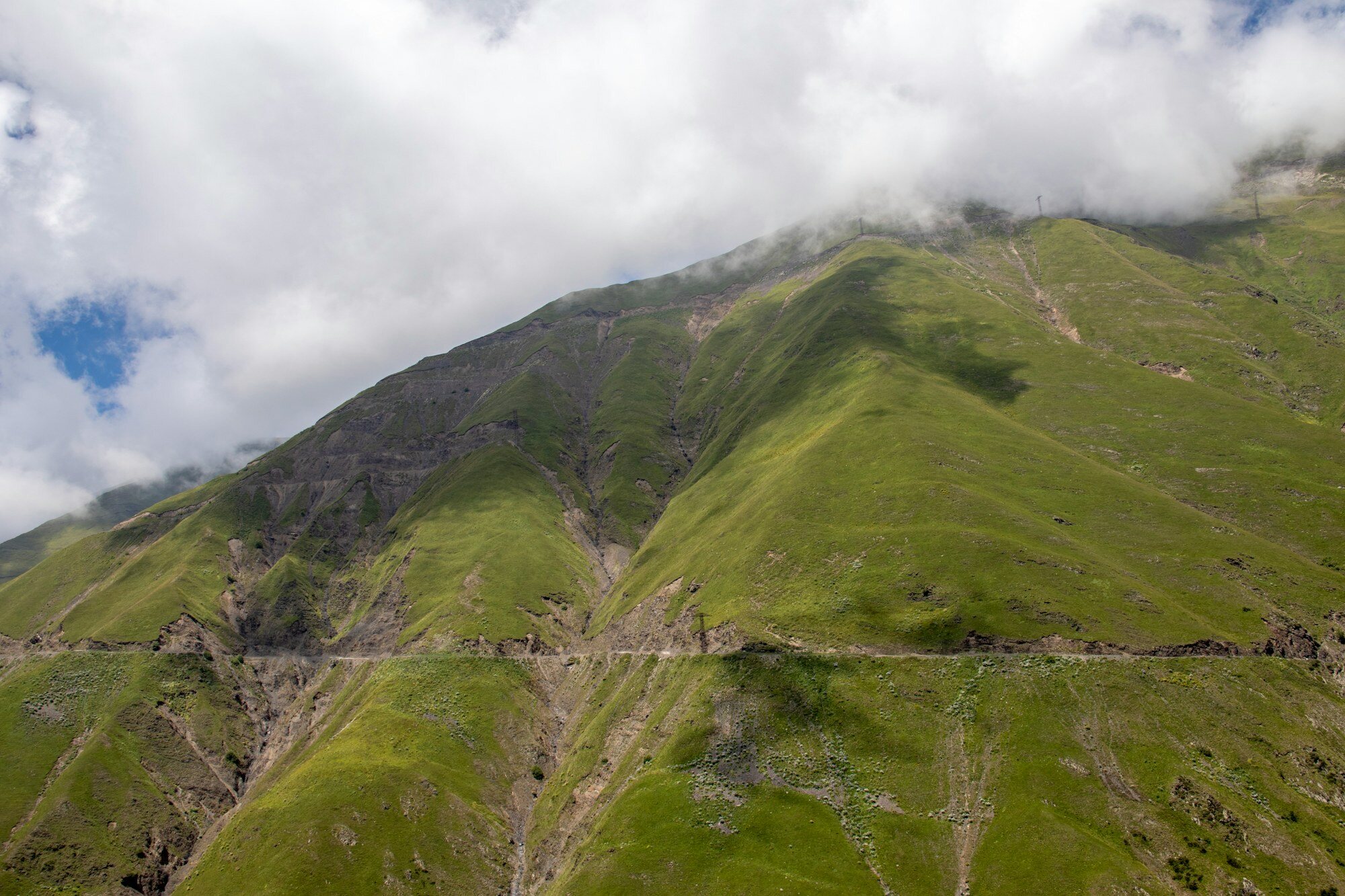 High mountain road scenery on the drive toward Kazbegi and Stepantsminda