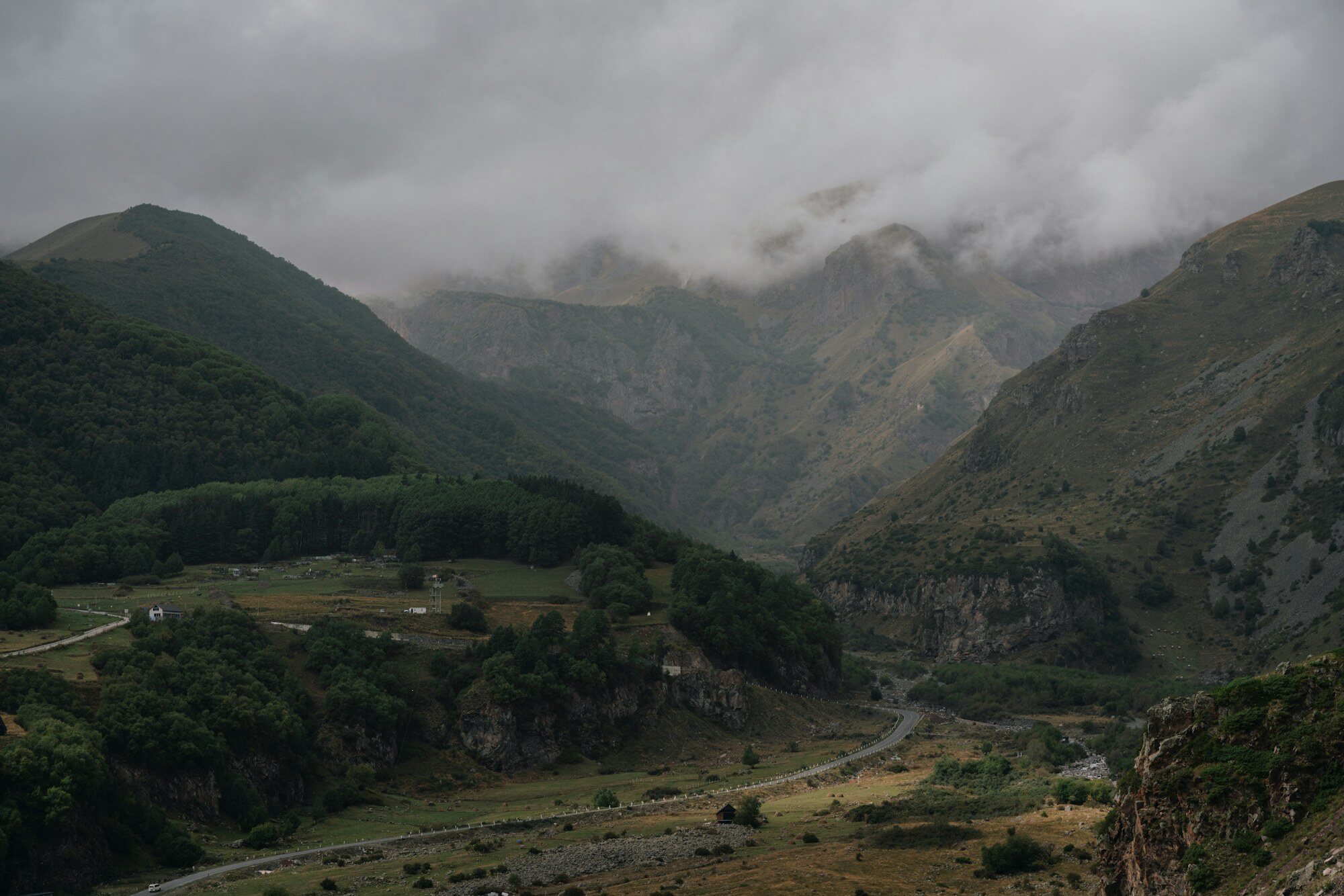 Misty Caucasus valley road showing the mountain driving character of the Georgia route