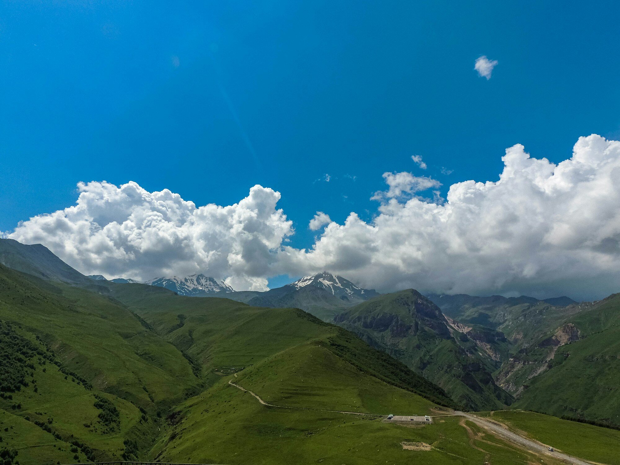 Green Kazbegi mountain valley during a Georgia road-trip weather reset day