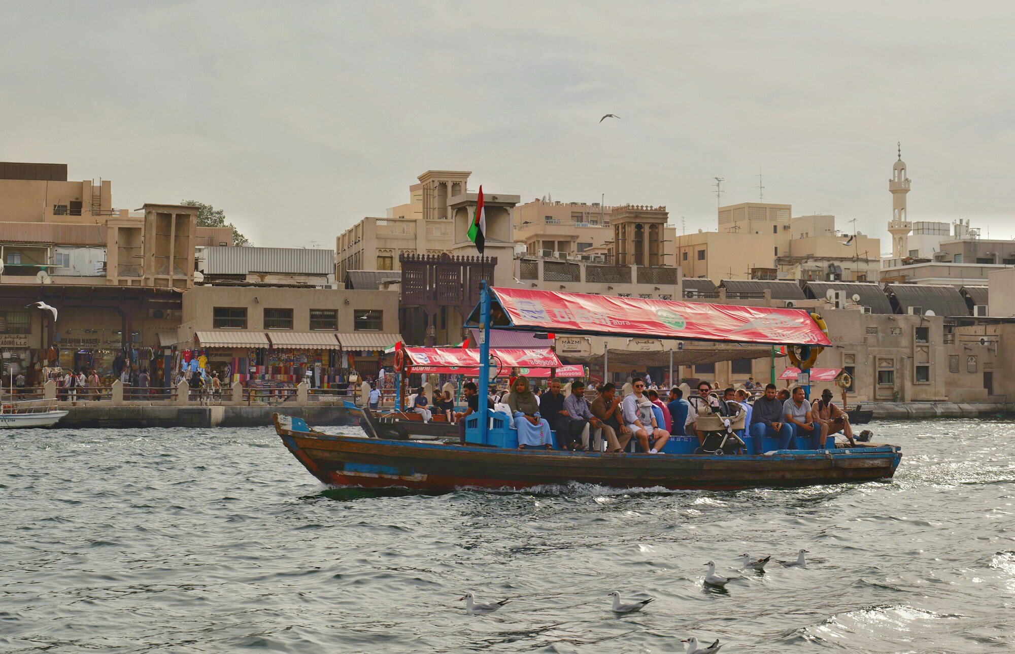 Traditional abra boat crossing Dubai Creek near Old Dubai
