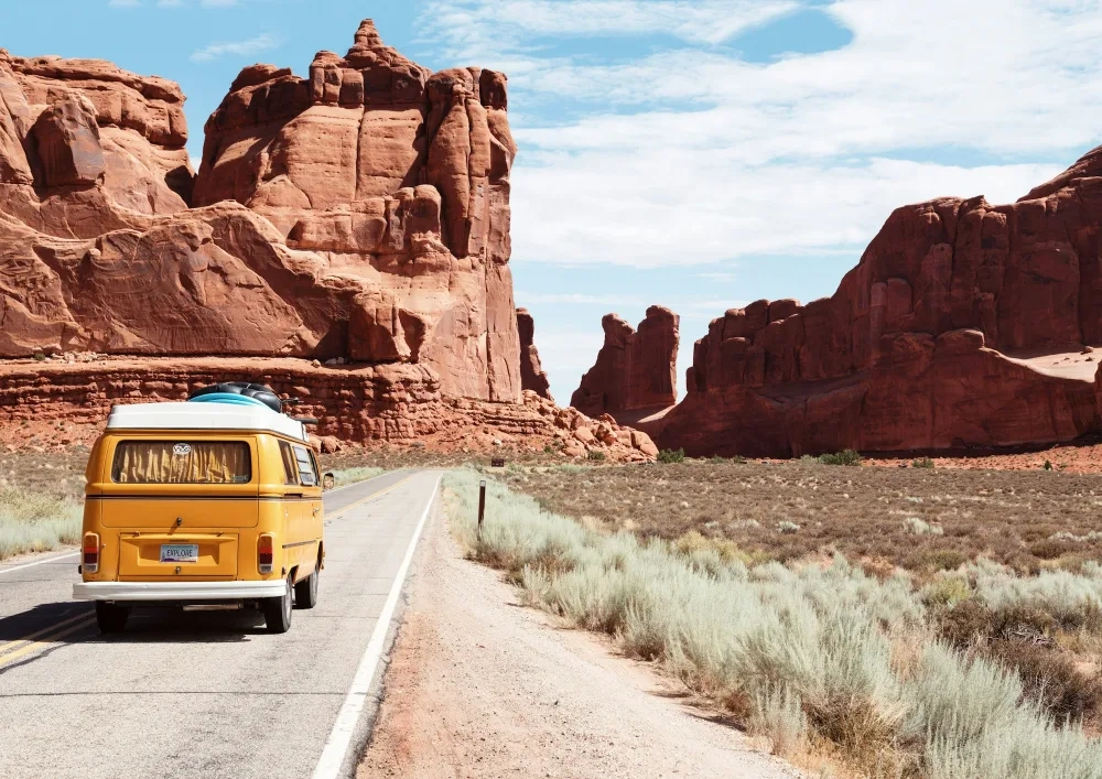A car driving along a scenic coastal road